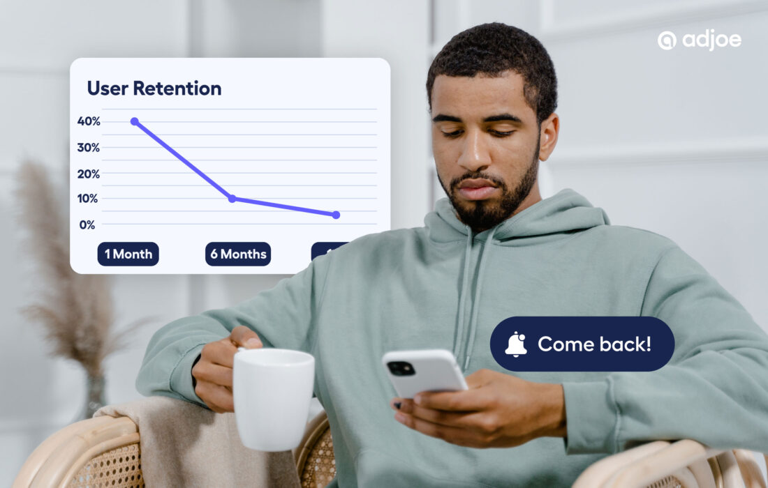 young man indoors holding his phone and hot drink with graph showing dropping retention in background