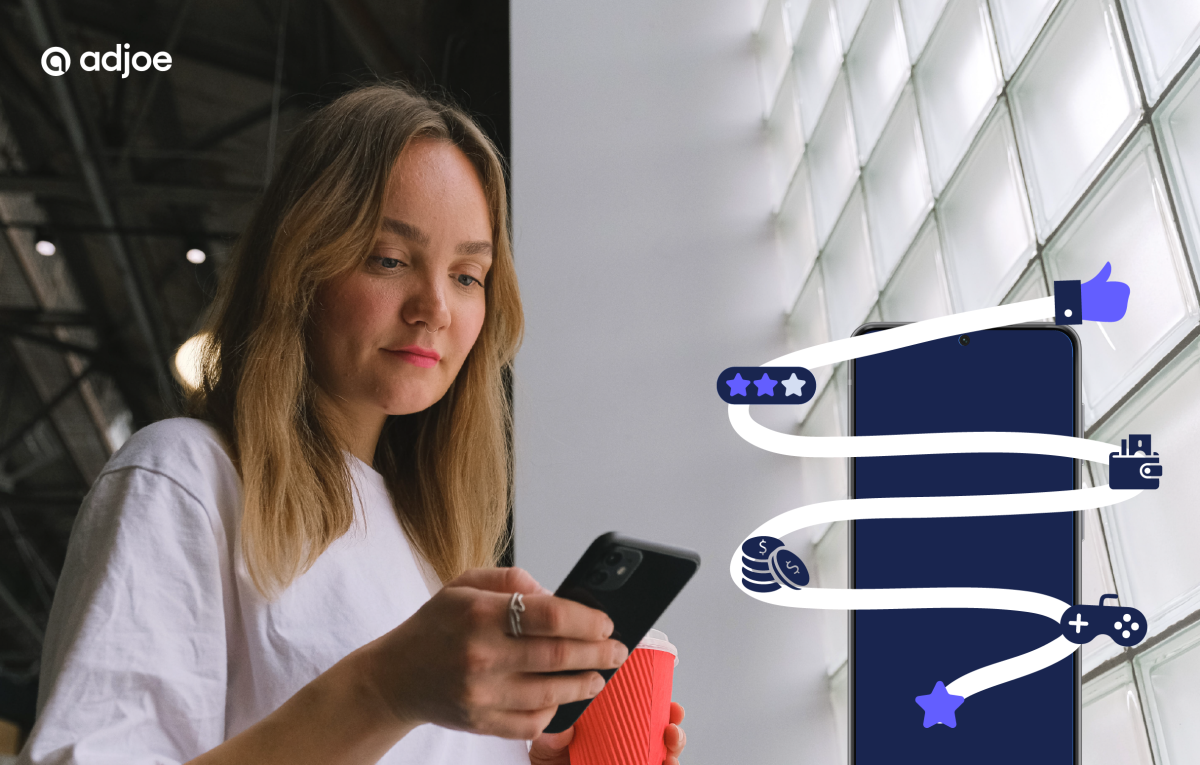 young woman looking down at her phone with a mockup of a phone and reward icons next to it
