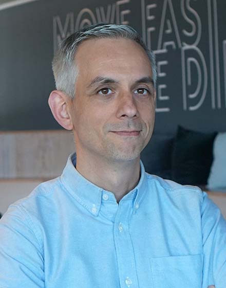 man in blue shirt looking into the distance