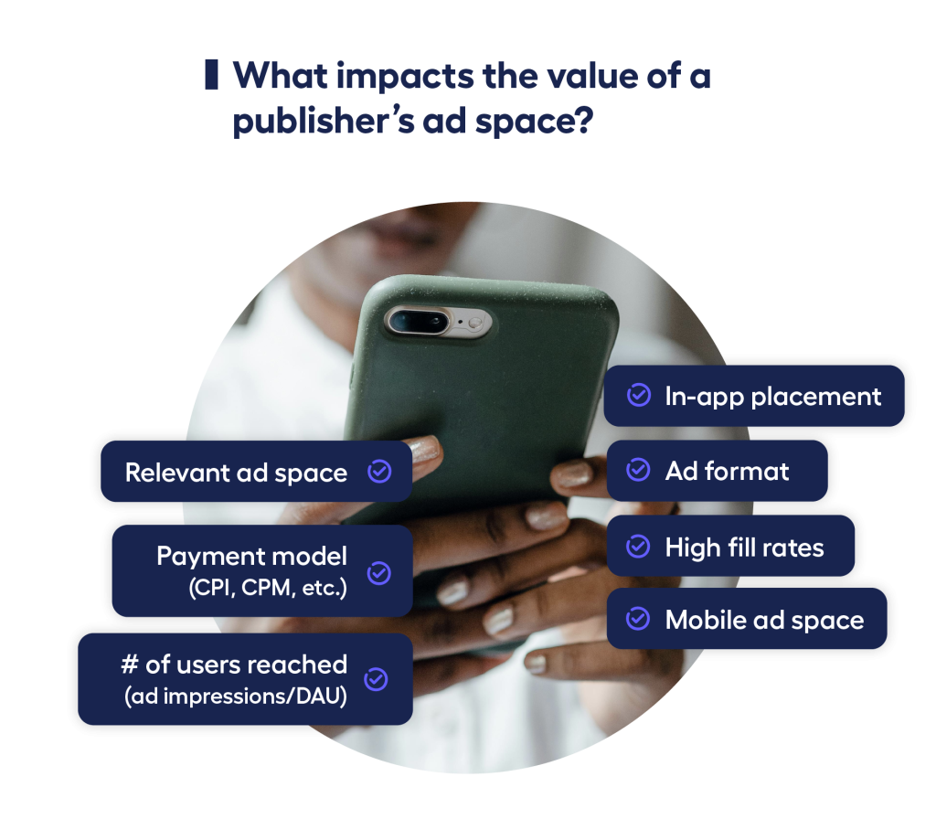 closeup of hands holding phone with factors influencing ad inventory value