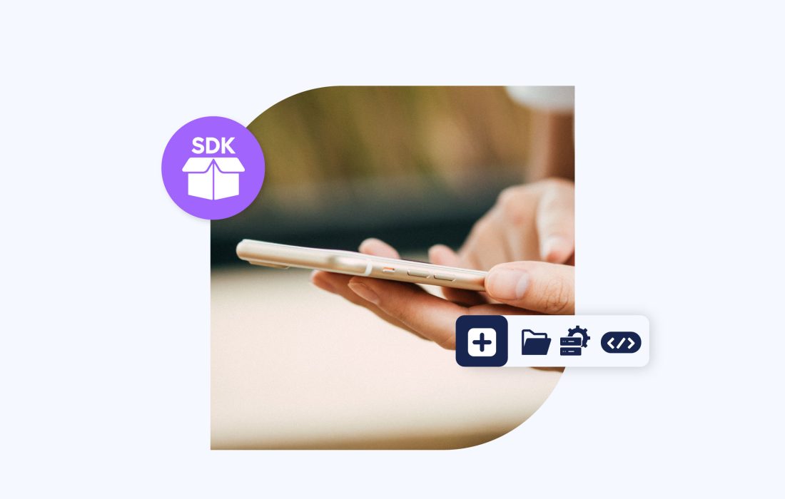 close-up of hand holding a phone with decorative sdk elements