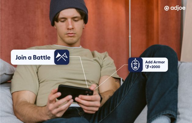 young man in a hat sat down relaxed looking at his phone screen