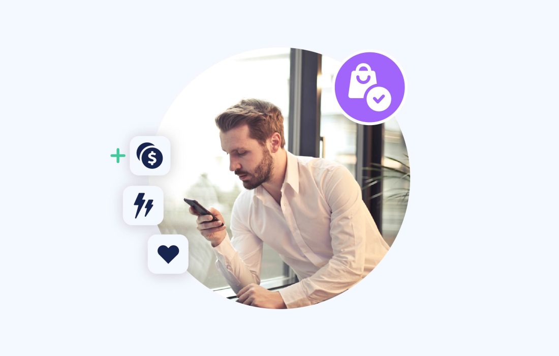 middle-aged man wearing a shirt in an office looking at his phone