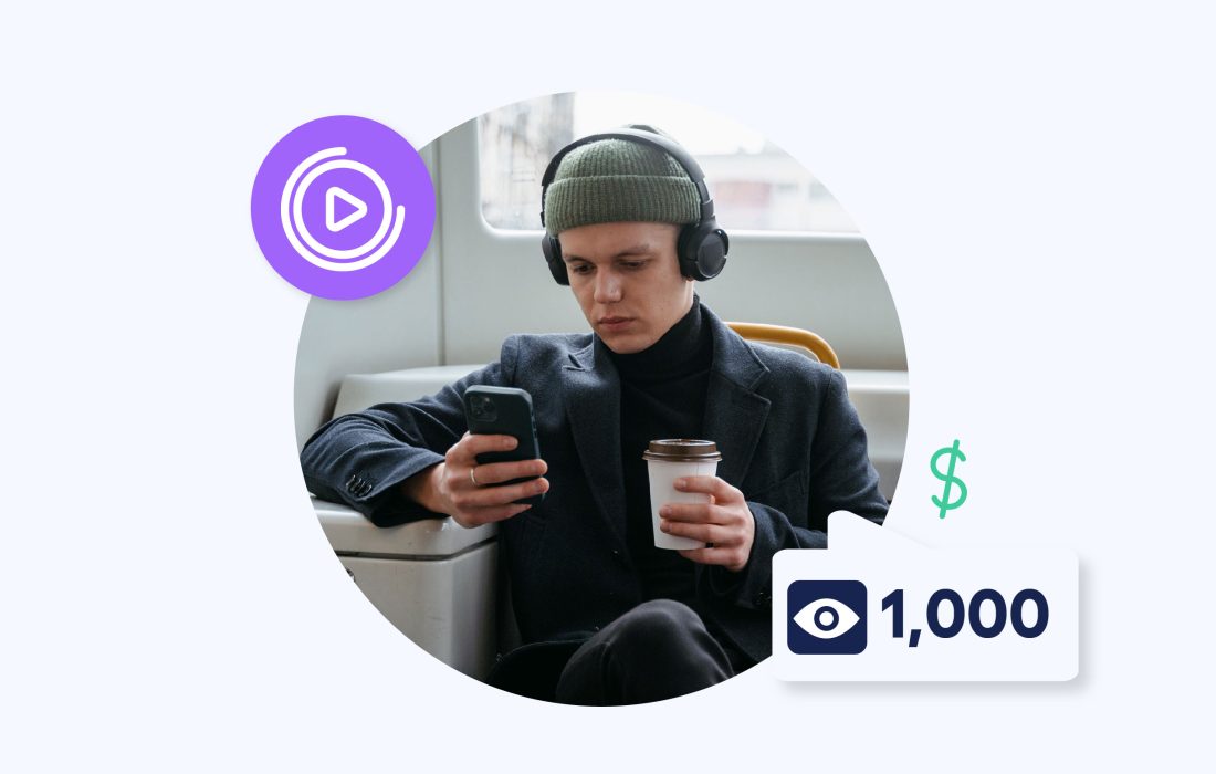 young man with a hat on and headphones looking at his phone screen with eye icon