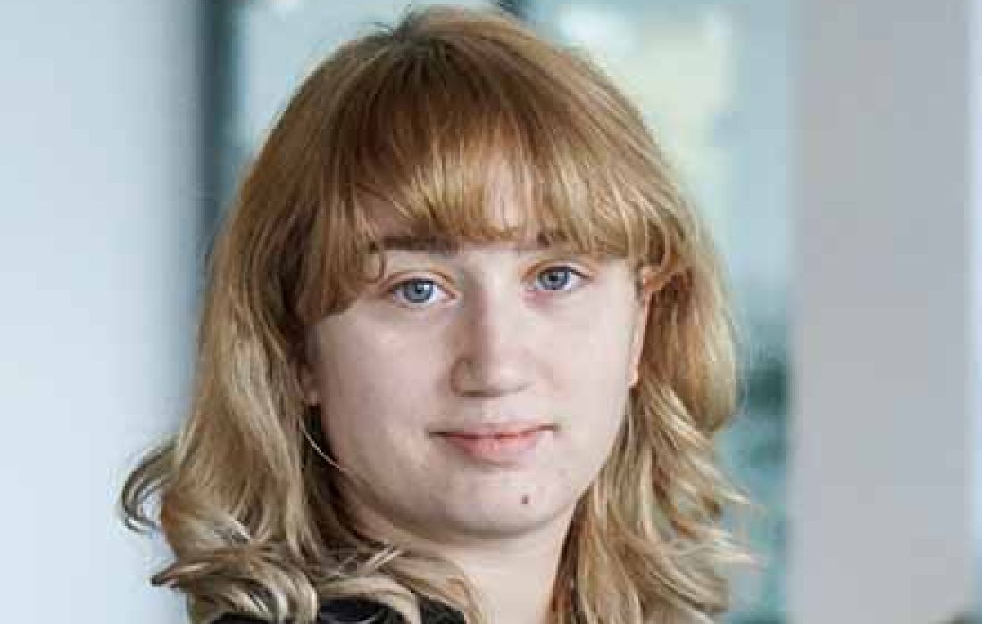 young blond woman looking at the camera