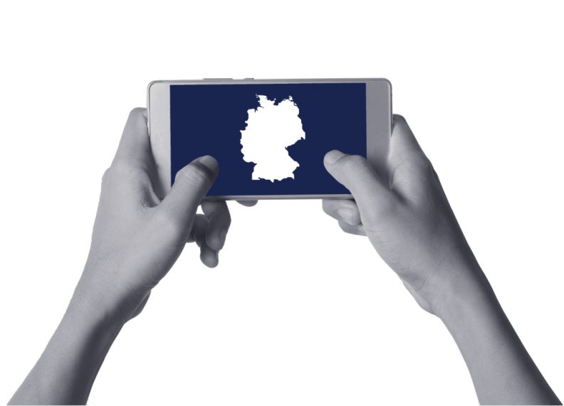 hands holding a smartphone with a map of germany