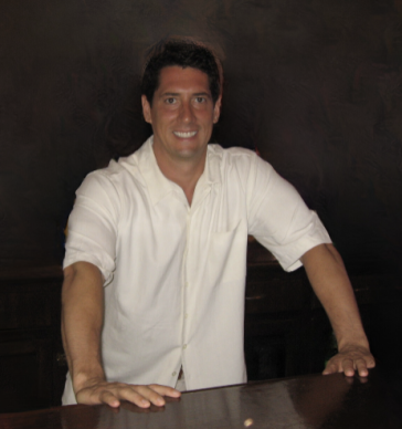 man in shirt smiling at camera