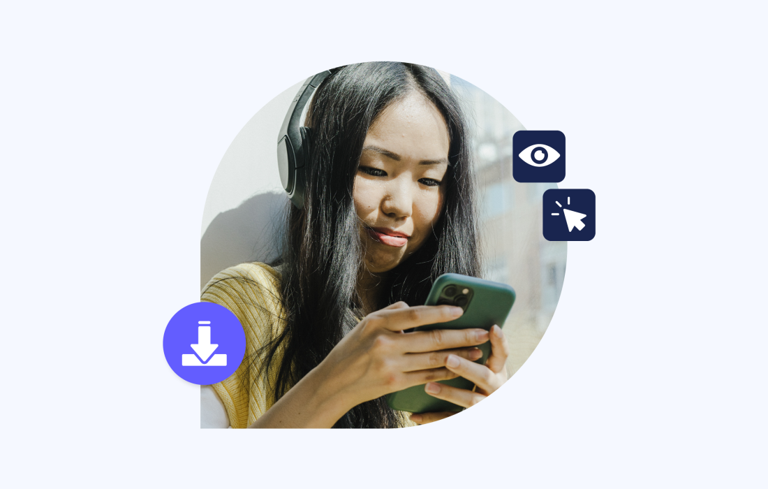 young woman with dark hair looking down at her phone