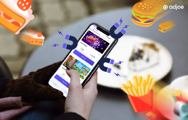 close-up of person holding phone with playtime offers and burger, chips icons as decorative elements