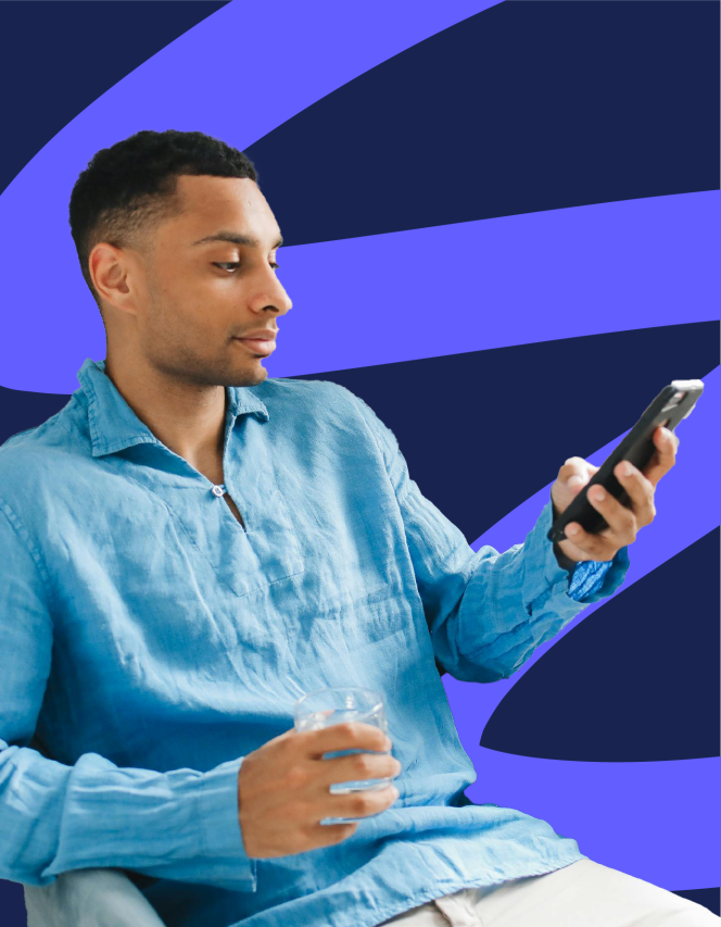 young man in a shirt looking at his phone