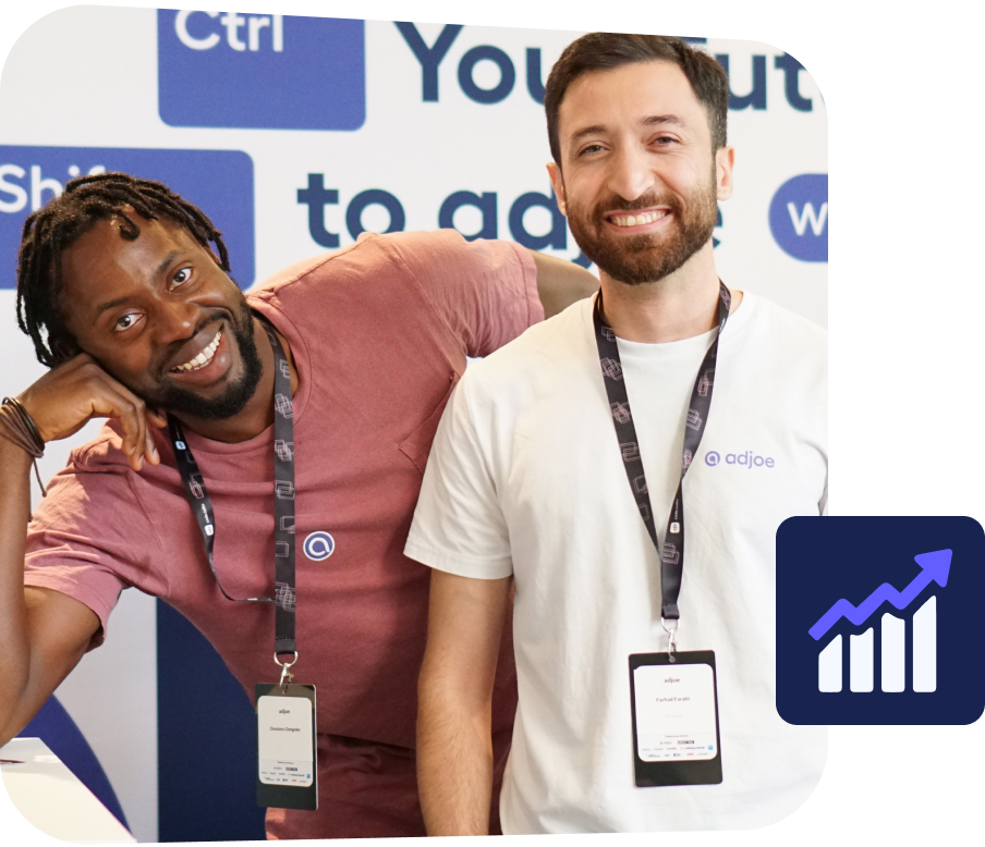 two young men smiling and looking at the camera
